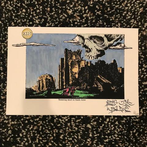Hand-colored print of "Towering Skull in Black Ruins"